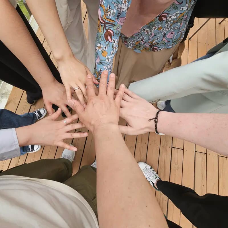 Crew hands joined together